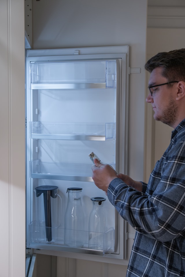 man near the refrigerator