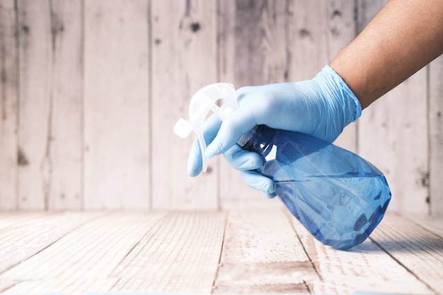 person holding cleaning equipment